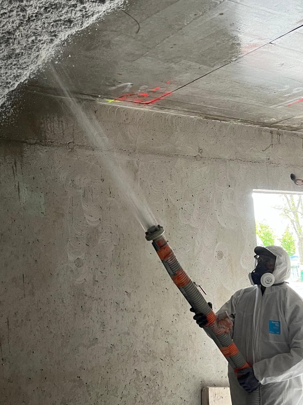 Flocage isolation thermique — Projection en cours